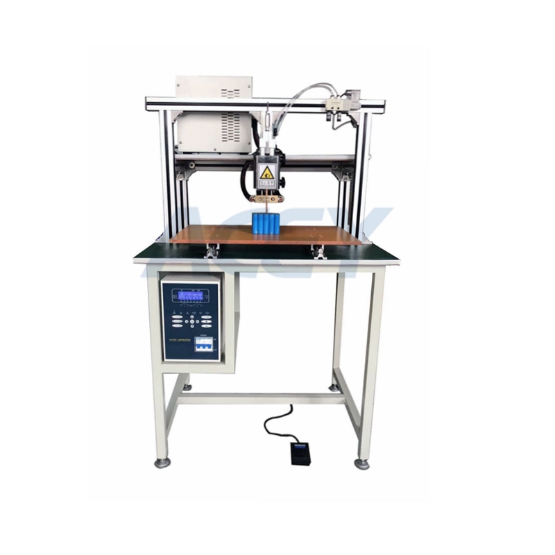 Spot welding machine with slide